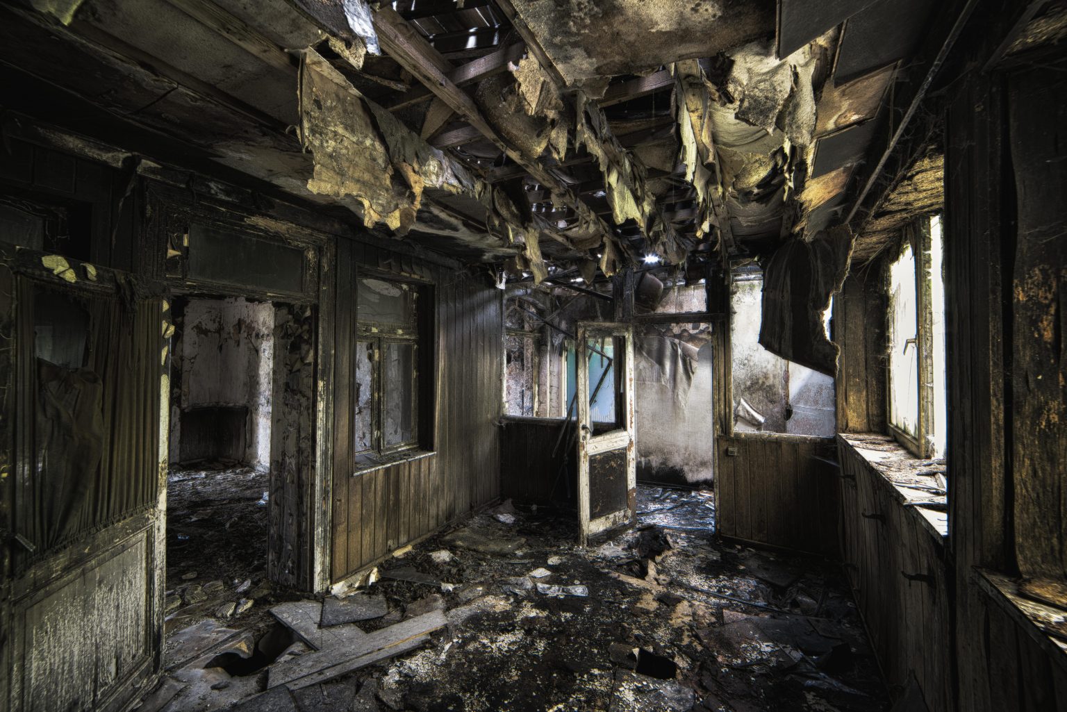 inside-shot-abandoned-destroyed-building-with-burned-walls-worn-out-doors-1536x1025